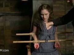 a sex slave struggles in bamboo bondage