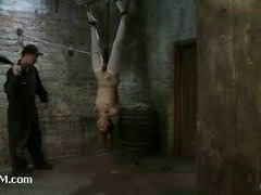 A helpless teen slut struggles hanging up side down