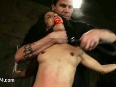 A lovesome curly babe hanged upside down in extreme suspension