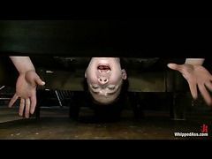 A submissive brunette gets fisted for the first time in lezdom action
