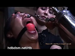 A restrained slut ordered to eat from the floor