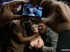 Blonde bombshell Skylar Price has pictures taken during a gangbang