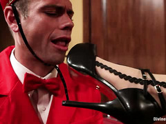 Maitresse Madeline seduces a hapless bellhop with her pretty feet