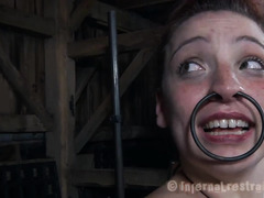 A restrained brunette cries out as her sensitive skin is caned