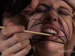 A squirming blonde is entwined by her devious and imaginative Mistress