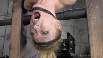 Voluptuous blonde gives lusty deepthroating while being bounded upside down
