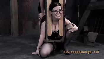 An innocent brunette cries as her body is pushed farther and farther