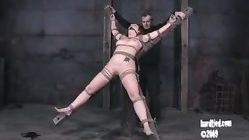 A pretty chick is bound, whipped, caned and fucked by an older Master